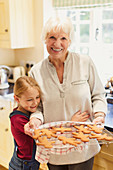 Grandmother and granddaughter baking