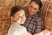 Girl holding hands with mother