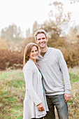 Portrait smiling couple in autumn park
