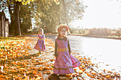 Toddler girls in Halloween costumes