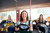 Woman riding bumper cars