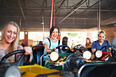 Friends riding bumper cars