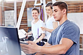 Physical therapists working at computer