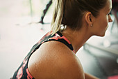 Sweating woman resting at gym