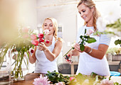 Florists arranging bouquet in flower shop