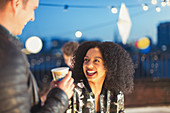 Young woman enjoying rooftop party
