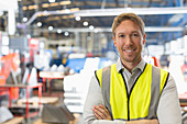 Portrait smiling supervisor in factory