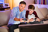 Father and son playing video game