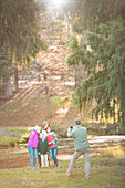 Father photographing family