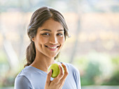 Close up Woman eating green apple