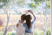 Couple taking selfie on patio