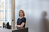 Businesswoman at conference room podium