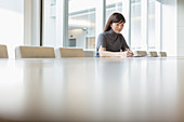 Businesswoman working in conference room
