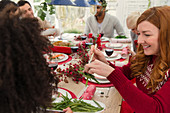 Woman serving at Christmas dinner