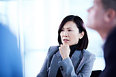 Businesswoman listening in meeting