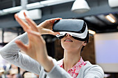 Woman trying virtual reality glasses