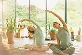 Pregnant women practicing yoga