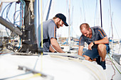 Men preparing sailboat