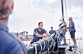 Men preparing sailing equipment