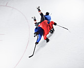 Hockey players colliding on ice