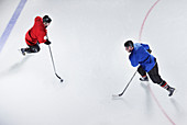 Overhead view hockey opponents with puck