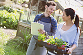 Plant nursery owners with potted plants