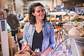 Smiling woman shopping in market