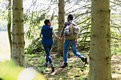 Couple holding hands and hiking