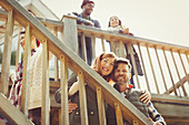 Smiling couple on stairs outside cabin