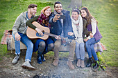 Friends taking selfie at campsite