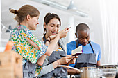 Women tasting food in cooking class