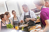 Students listening to chef teacher