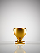 Empty golden egg cup holder