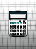 Calculator on grid grey background