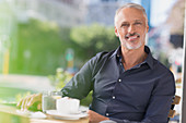 Portrait smiling man drinking coffee