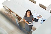 Portrait businesswoman drinking coffee