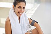 Woman with towel and water bottle