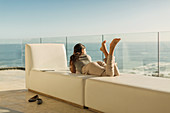 Woman on luxury balcony relaxing