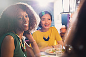 Women friends talking and dining