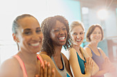 Portrait enthusiastic women in yoga class