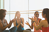 Smiling women in exercise class gym studio