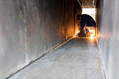 Welder using welding torch in steel tunnel