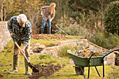 Couple gardening doing yard work