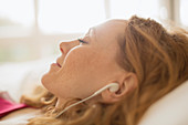 Close up serene woman with headphones