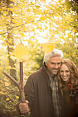 Portrait smiling couple with walking stick