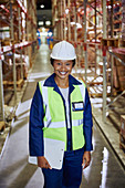 Portrait smiling female worker aisle