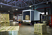 Trucks and cardboard box pallets
