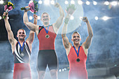 Male gymnasts on winners podium