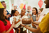Multi-generation family celebrating birthday