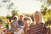 Smiling woman drinking wine